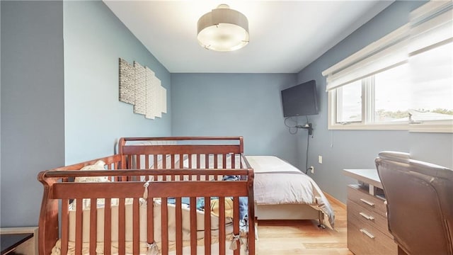 bedroom with wood finished floors