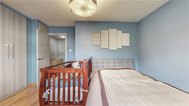 bedroom featuring light wood-type flooring