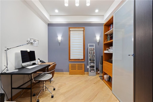 office with light hardwood / wood-style floors