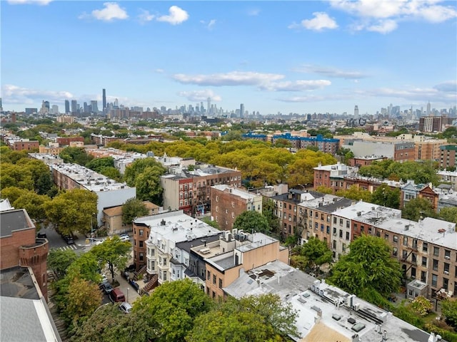 birds eye view of property with a view of city