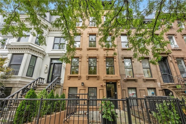 view of property featuring a fenced front yard