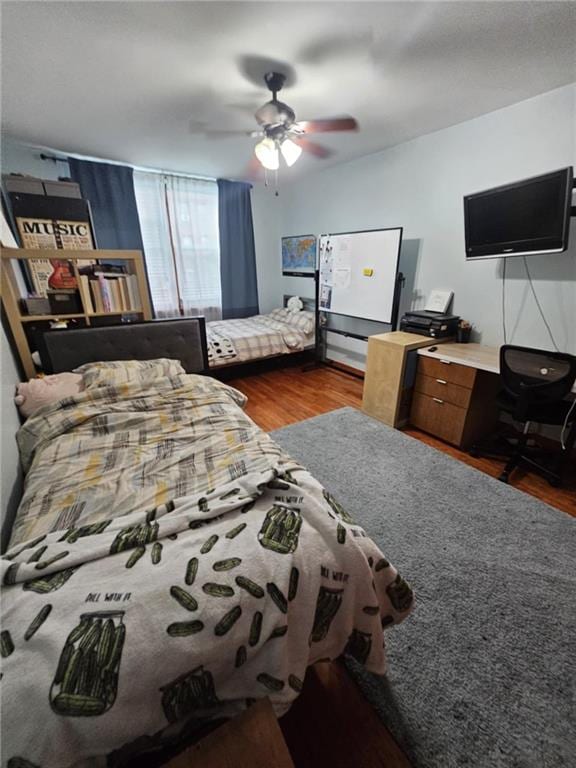 bedroom featuring dark wood-type flooring and ceiling fan