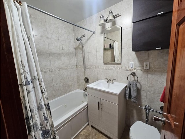 full bathroom with shower / bath combination with curtain, vanity, tile patterned floors, tile walls, and toilet