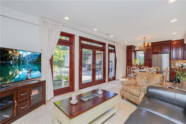 living room with a chandelier and french doors