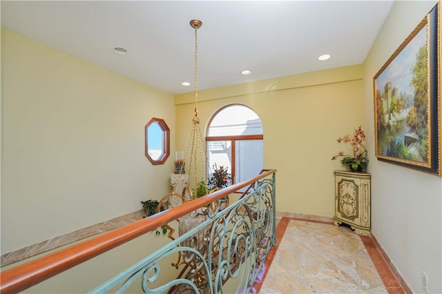 hall featuring light tile patterned floors