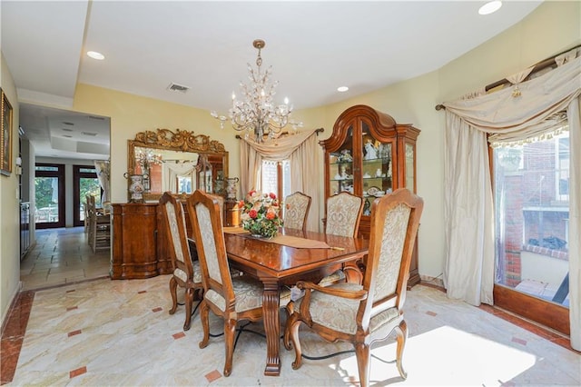 dining space featuring an inviting chandelier