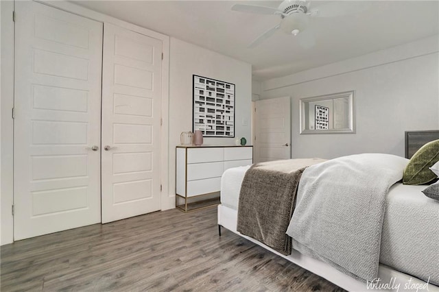 bedroom featuring ceiling fan and wood finished floors