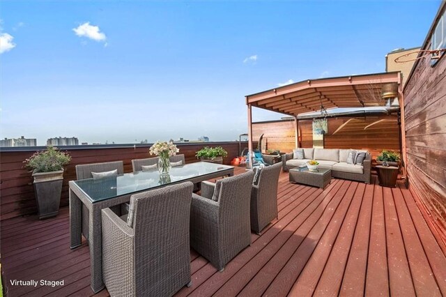 wooden deck featuring outdoor lounge area