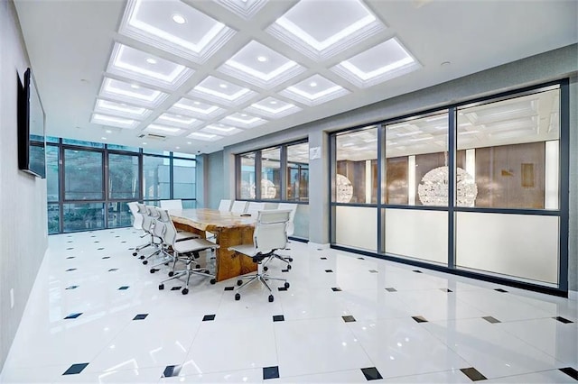 unfurnished sunroom featuring beamed ceiling, a wealth of natural light, and coffered ceiling