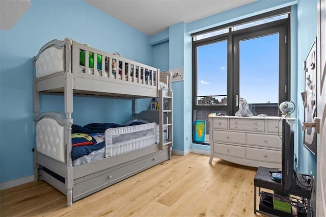 bedroom with light hardwood / wood-style floors