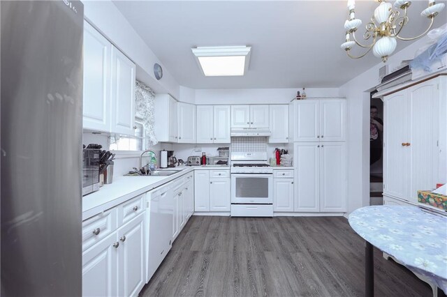 kitchen featuring white cabinetry, sink, light wood-type flooring, and white appliances