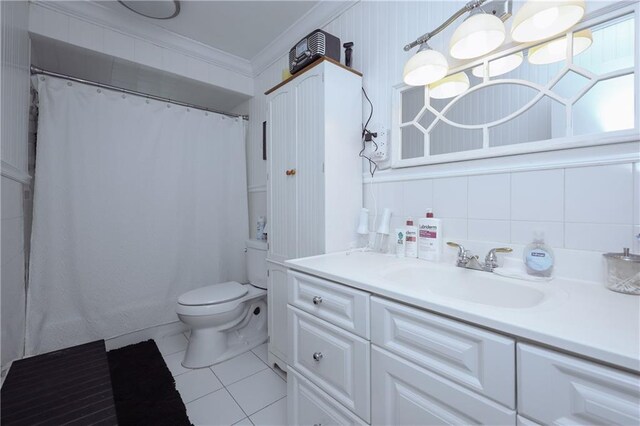 bathroom featuring decorative backsplash, toilet, ornamental molding, vanity, and tile patterned floors