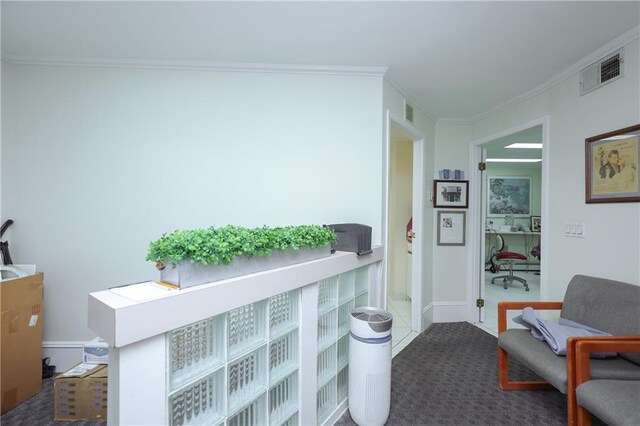 interior space featuring crown molding and carpet flooring