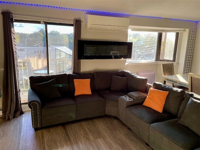 living room featuring hardwood / wood-style flooring and a wall mounted AC