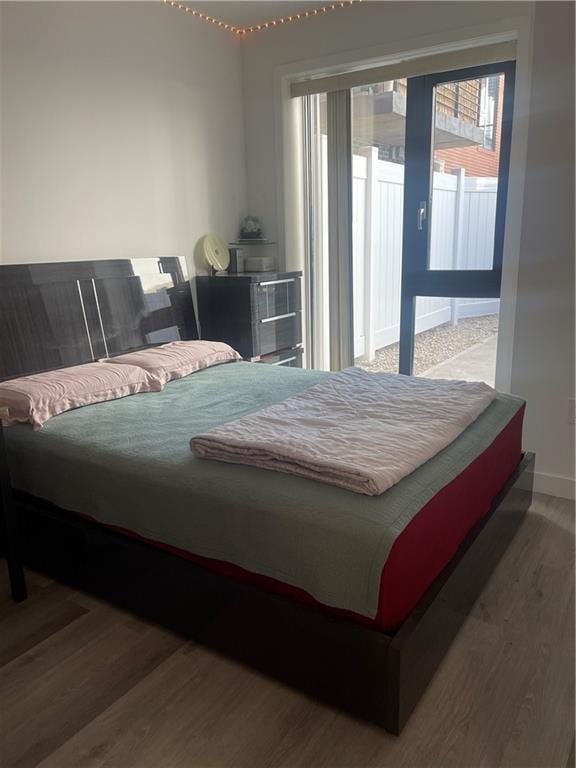 bedroom with wood-type flooring