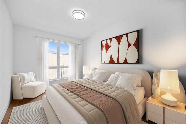 bedroom with hardwood / wood-style flooring