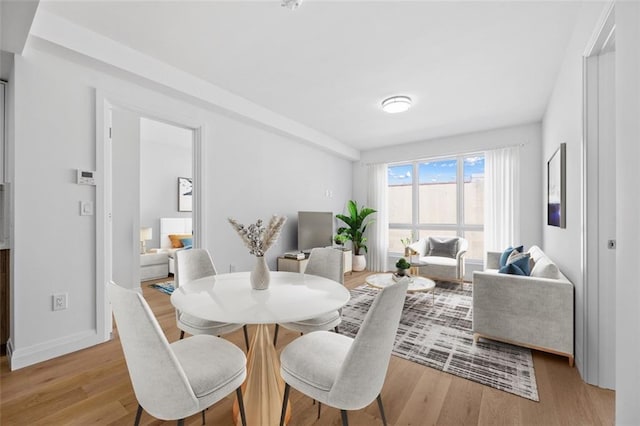 dining area with light hardwood / wood-style flooring