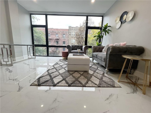 living room featuring floor to ceiling windows