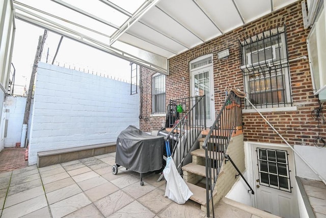 view of patio featuring a grill