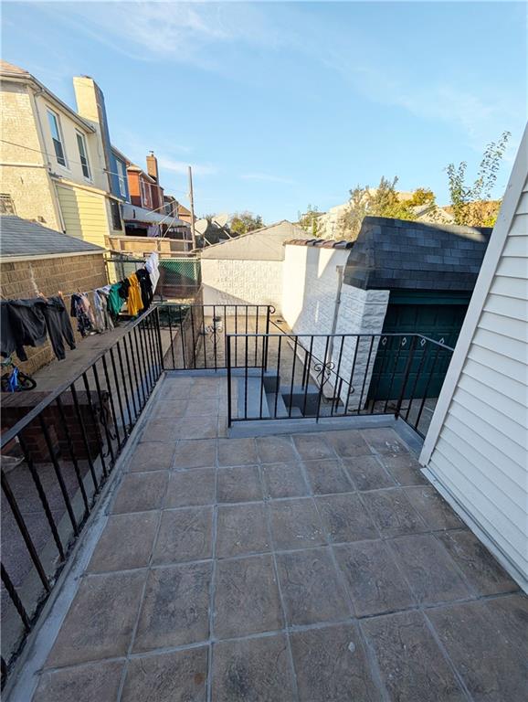 view of patio featuring a balcony