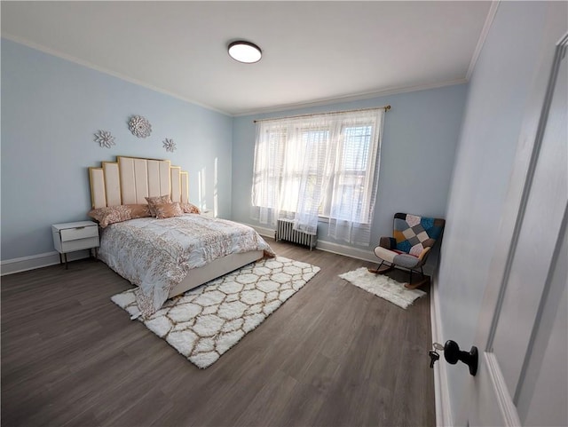 bedroom featuring ornamental molding, radiator, and dark hardwood / wood-style floors