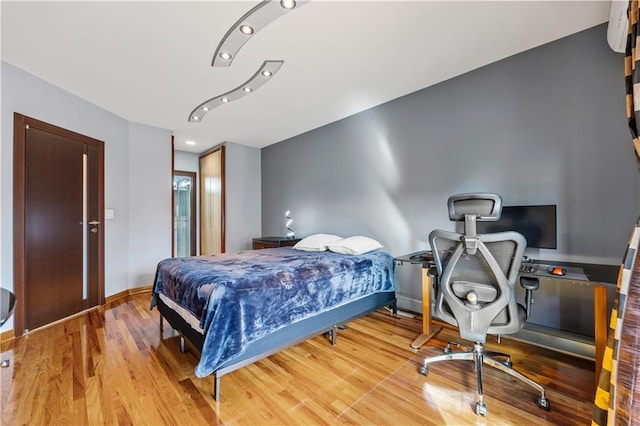 bedroom with light hardwood / wood-style flooring