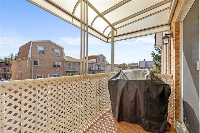 view of patio featuring a balcony and grilling area