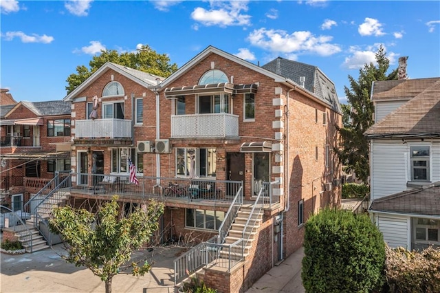 view of front of house featuring a balcony