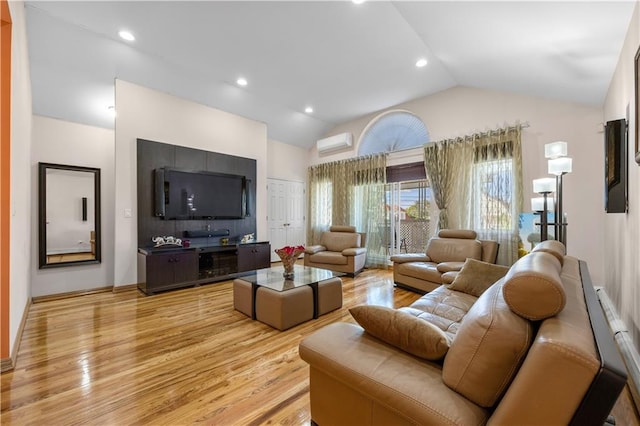 2643 E 24th St Unit 3A, Brooklyn, NY 11235 - living area featuring light wood-style flooring, vaulted ceiling, recessed lighting, and a wall mounted AC