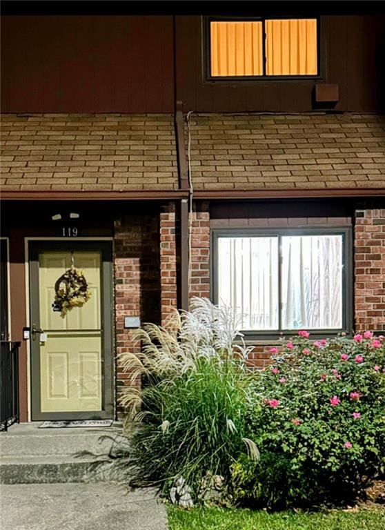 119 Stonegate Dr Unit 119, Staten Island, NY 10304 - property entrance with brick siding and roof with shingles
