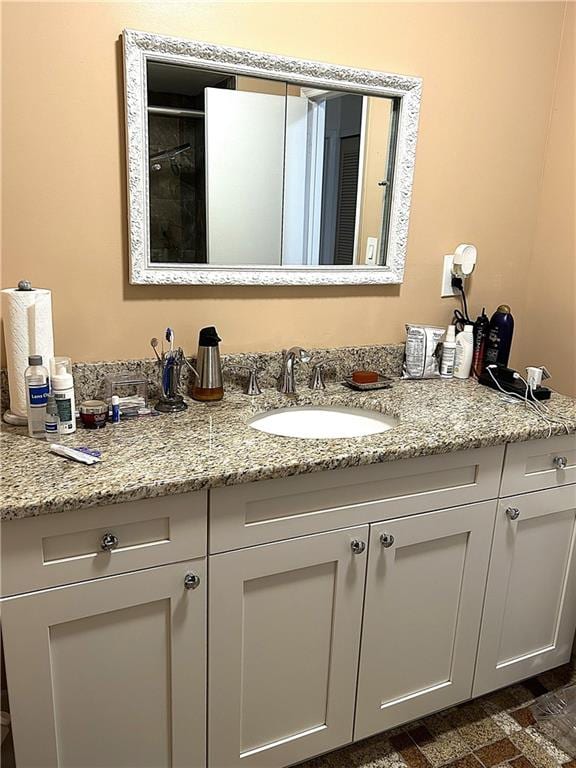 bathroom featuring vanity and a shower