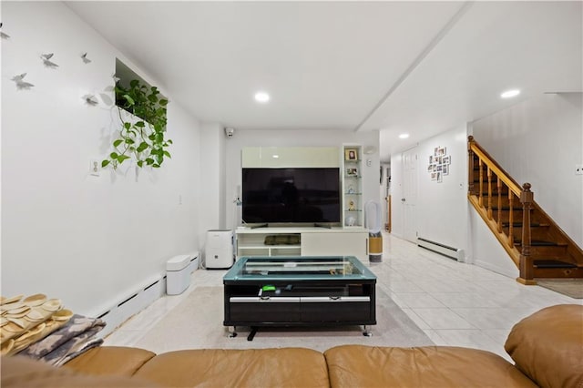 living room featuring baseboard heating and light tile patterned flooring