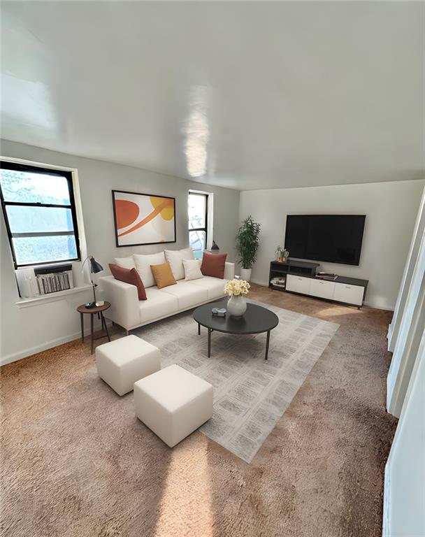 living room featuring plenty of natural light, carpet flooring, and cooling unit