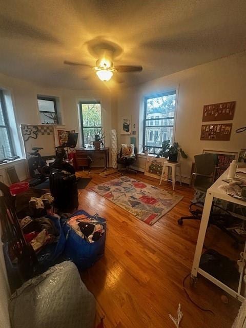 interior space featuring ceiling fan and hardwood / wood-style floors