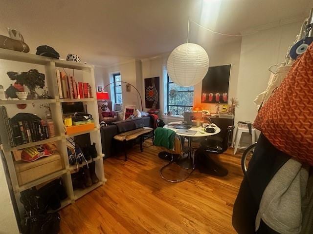 interior space featuring crown molding and hardwood / wood-style floors