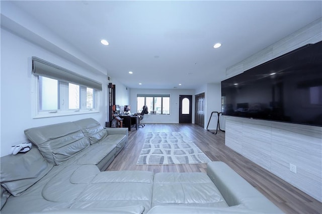 unfurnished living room featuring hardwood / wood-style flooring