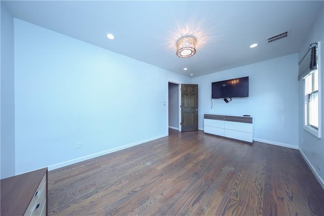 unfurnished living room with dark hardwood / wood-style floors