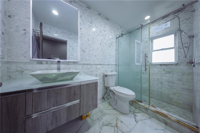 bathroom with walk in shower, vanity, and toilet