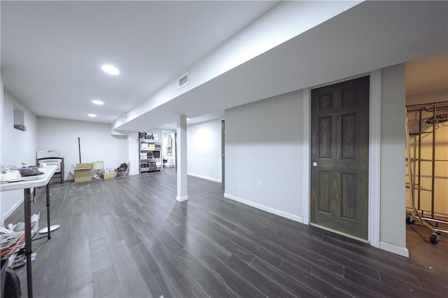 basement featuring dark wood-type flooring