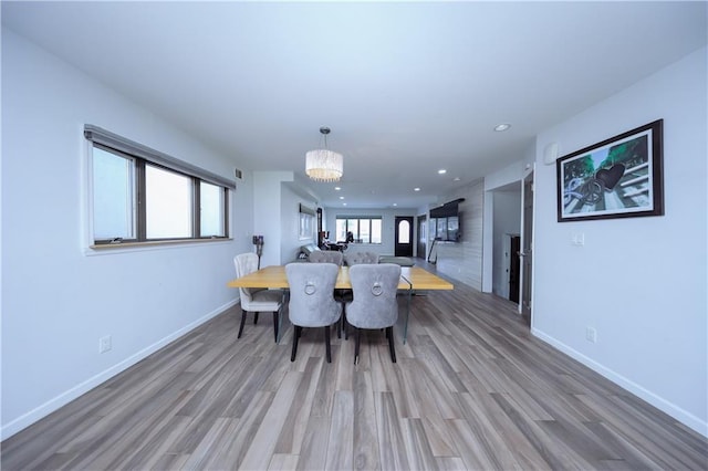 dining room featuring a chandelier and hardwood / wood-style floors