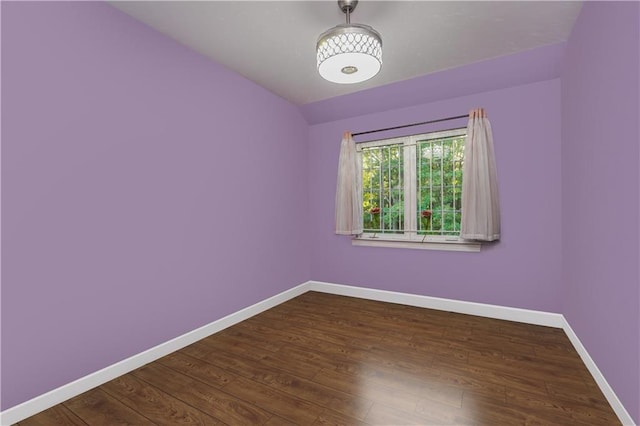 empty room with dark wood-type flooring