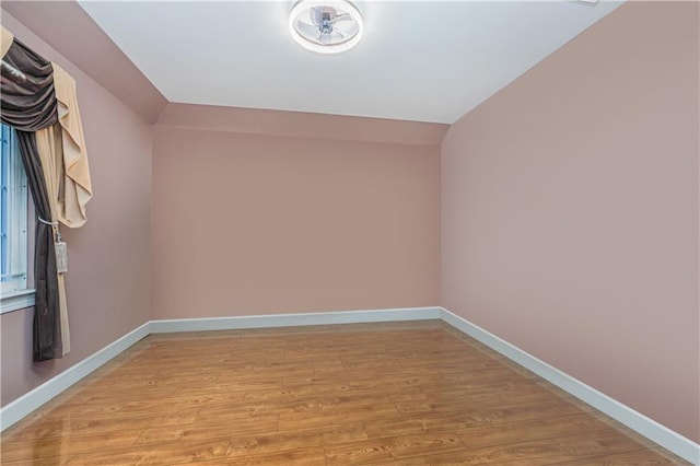 bonus room featuring lofted ceiling and light hardwood / wood-style floors