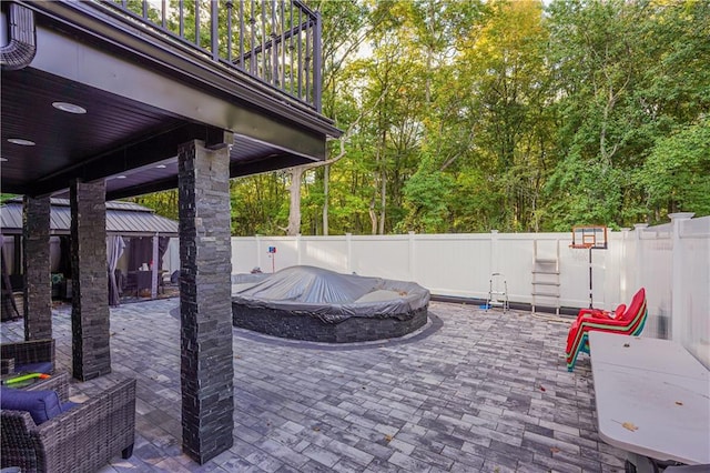 view of patio / terrace featuring a pool