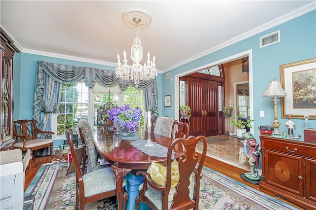 15 The Oval, Staten Island, NY 10304 - dining room featuring a chandelier, ornamental molding, wood finished floors, and visible vents