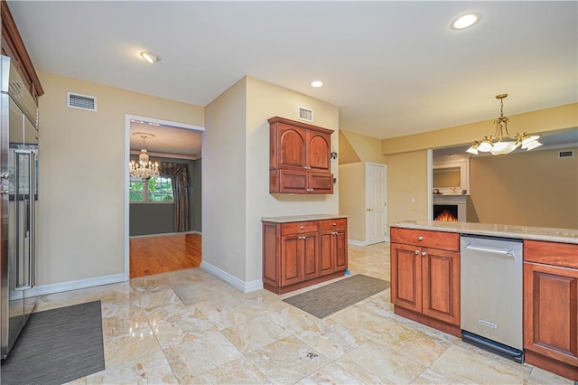 kitchen with light countertops, marble finish floor, an inviting chandelier, and visible vents