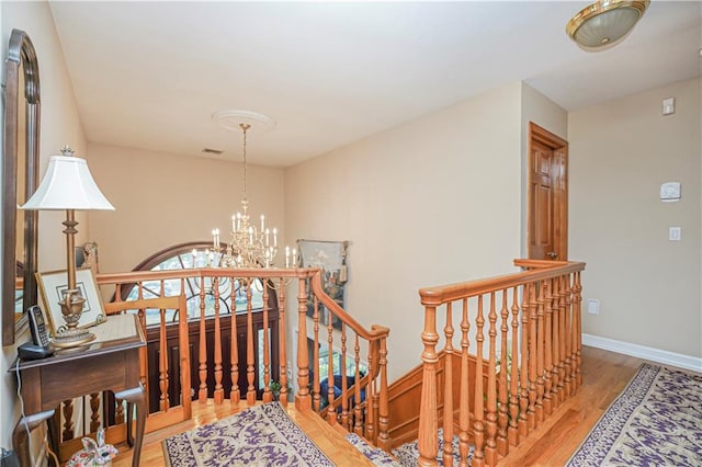 15 The Oval, Staten Island, NY 10304 - interior space featuring a chandelier, visible vents, wood finished floors, baseboards, and an upstairs landing