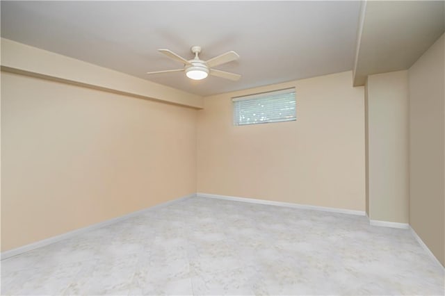 unfurnished room featuring baseboards and ceiling fan