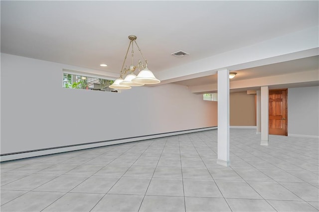 interior space with baseboard heating, recessed lighting, baseboards, light tile patterned floors, and visible vents