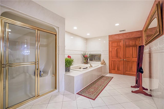 full bathroom featuring tile patterned floors, a stall shower, a garden tub, and visible vents