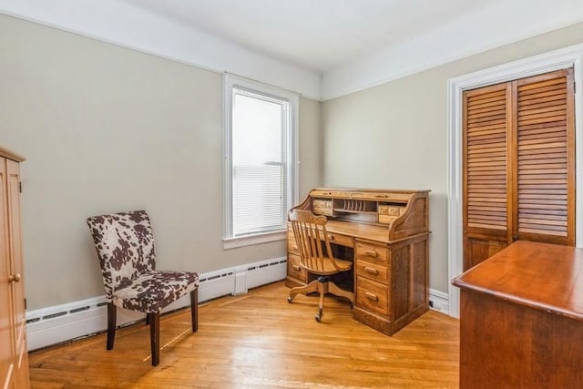 office area with light hardwood / wood-style floors